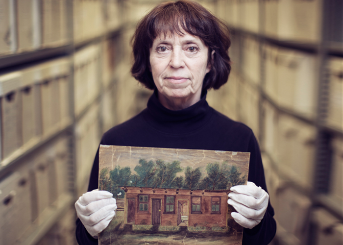 Linda White holds a sketch drawn by Frances Cluett that depicts the field hospital where she served as a VAD