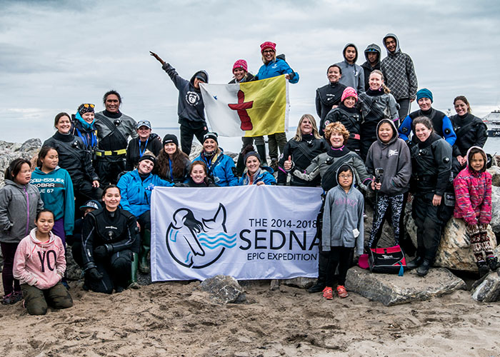 Sedna Expedition members and youth in Pond Inlet, Nunavut. 
PHOTO: Amanda Cotton/Sedna Expedition