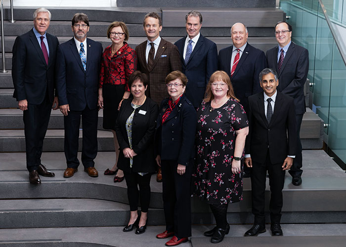 Group photo: A number of dignitaries, special guests and Memorial officials participated at the official opening of Signal Hill Campus on Sept. 29, 2018. Pictured here are (L to R, top row): The Honourable Dwight Ball, premier of Newfoundland and Labrador; His Honour Howard Foote; The Honourable Judy Foote, lieutenant-governor of Newfoundland and Labrador; The Honourable Seamus O’Regan, minister, Indigenous Services; Scott Balfour, CEO, Emera Inc.; Dr. Gary Kachanoski, president and vice-chancellor, Memorial University; Dr. Rob Greenwood, executive director, Office of Public Engagement, Memorial University. L to R (front row): Iris Petten, chair, Board of Regents, Memorial University; Dr. Susan Dyer-Knight, chancellor, Memorial University; Jennifer Adams, lead, strategic development, Signal Hill Campus, Memorial University; Richard Kissoon, graduate student, Memorial University. 
PHOTO: Rich Blenkinsopp