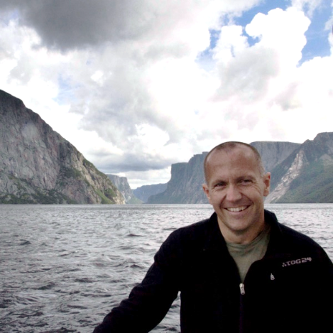 Dr. Duncan Mcllroy with view of Western Brook in the background