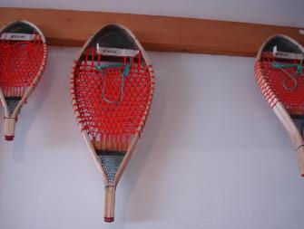 Elliott, George. Snowshoes made by George Elliott hanging in the local Hare Bay Foodex shop, Main Brook