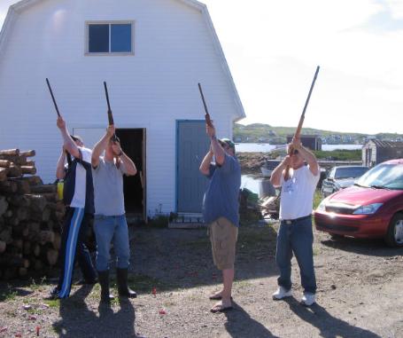 Pentons, with guns raised and prepared to shoot, in celebration of a family wedding, Joe Batt's Arm 