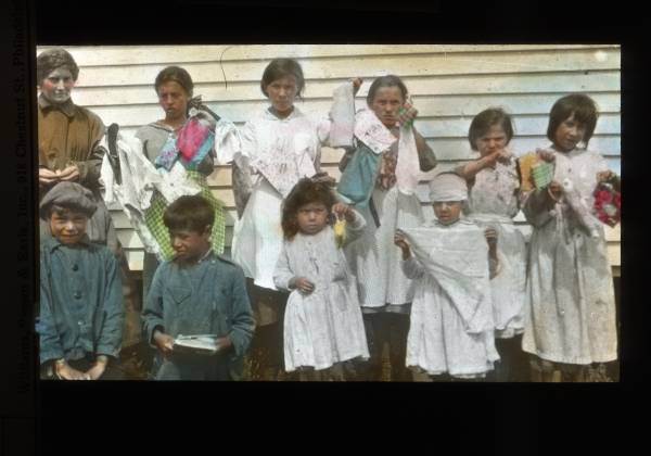 School children holding hand made objects, 1915