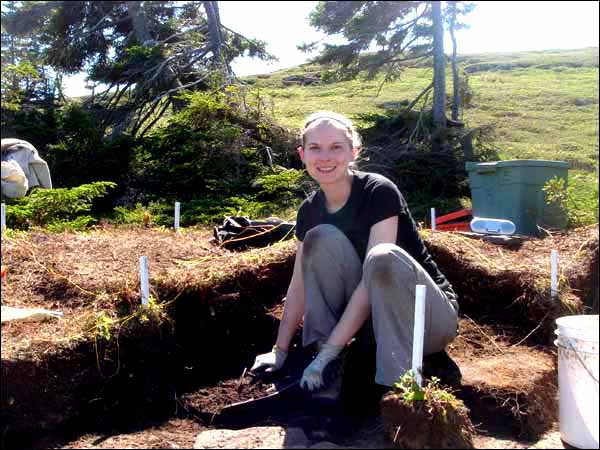 Phoebe Murphy working on an Inuit sod house at Indian Harbour