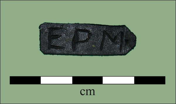 Nineteenth-century leather tag recovered from Newfoundland fisheries house, Sandwich Bay