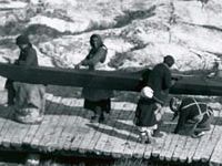 Inuit women building a kayak