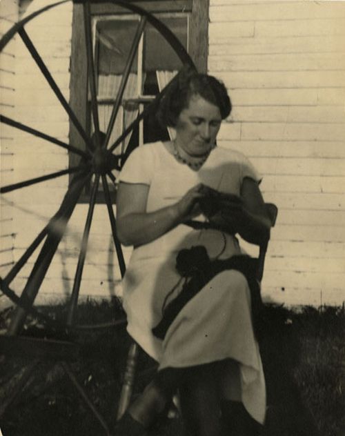 alice boland knitting outside her house