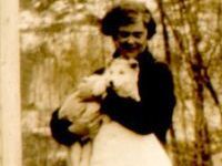 woman holding puppy