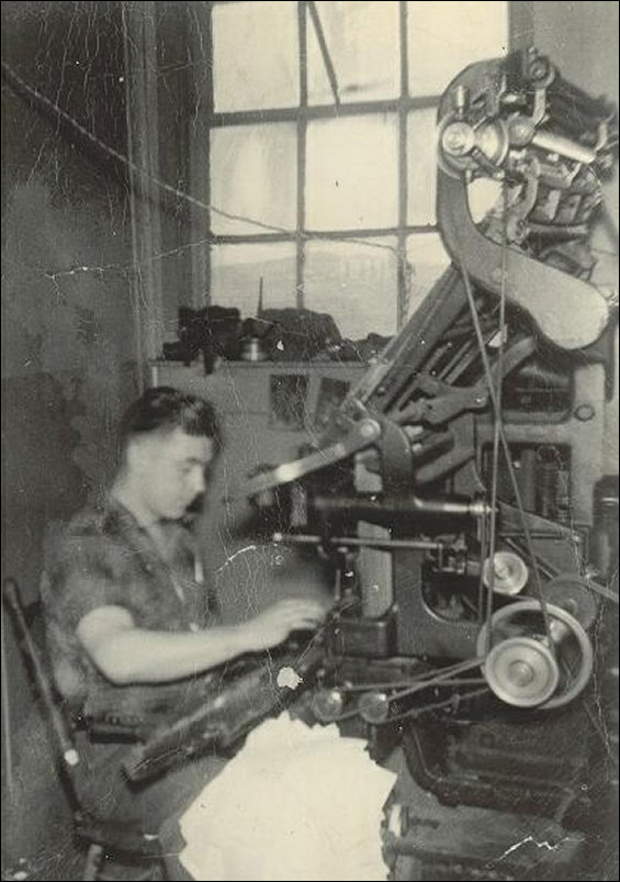 Arthur Sweetland operating the linotype machine at the Fishermens Advocat.