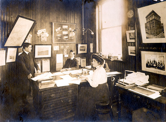 Three people in Job Brothers & Co. shipping office