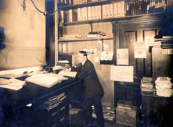 Man in Job Brothers & Co. insurance office