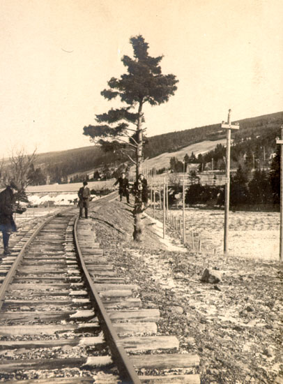 Four men on a railway track
