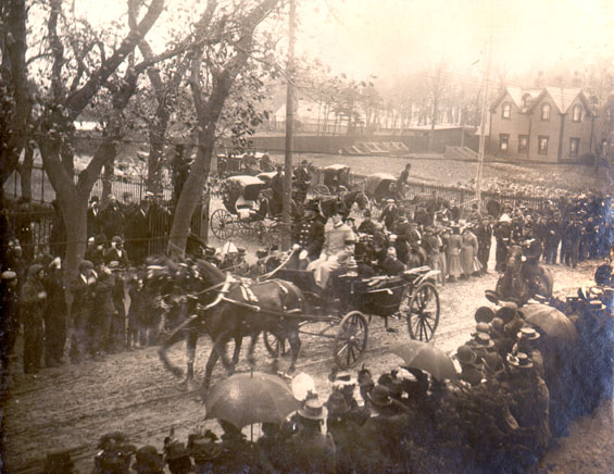 Duke and Duchess of York and Cornwall riding in a horse drawn carriage on Military Road, St. John's