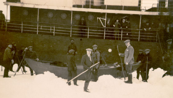 Group of men standing near a rescue boat