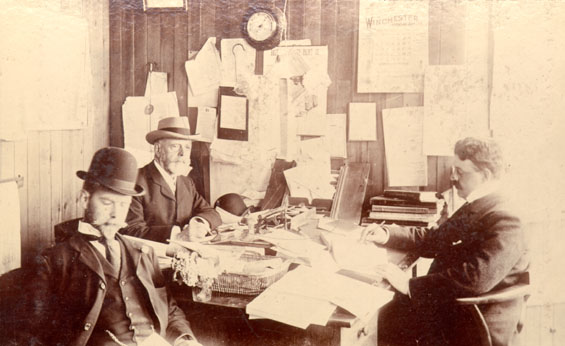Robert Brown Job, Thomas Raffles Job and William Carson Job in an office at Job Brothers & Co.