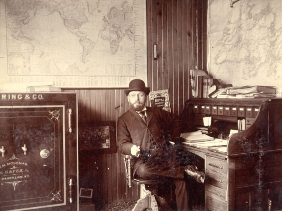 Mr. C. MacPherson, manager of Royal Stores, in his office