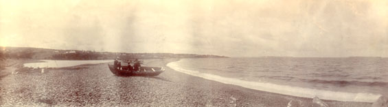 Panorama of a boat hauled up on Topsail Beach, Conception Bay