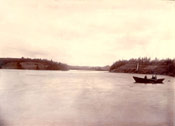 Men rowing in a boat on South East Arm, Placentia