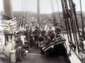 Crew on the deck of an unidentified fishing schooner