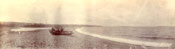 Panorama of a boat hauled up on Topsail Beach, Conception Bay