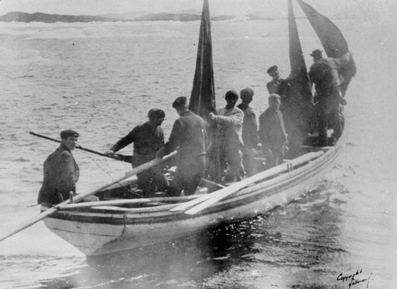 8 men in a Newfoundland punt with two sails