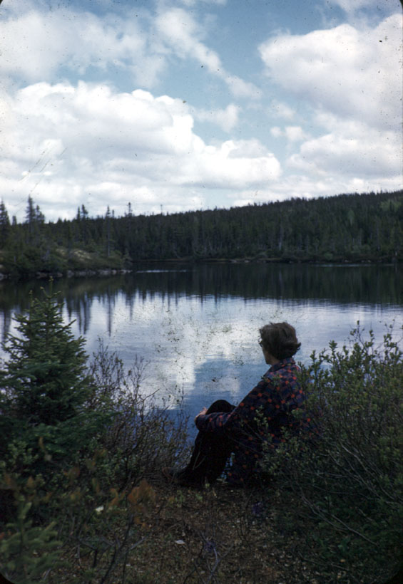 Jean Smith sitting near a pond or lake in Labrador