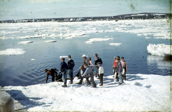 Kids collecting the mail from the water, Cartwright, Labrador