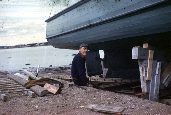 Harvey Bird repairing a boat in Cartwright, Labrador