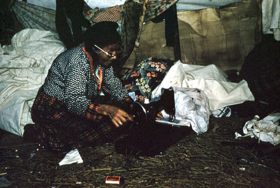 Mrs. Charlie Rich, sewing in Labrador