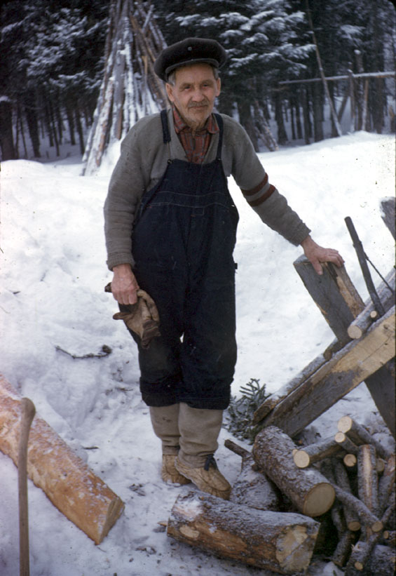 Bob Bird of Dove Brook, Labrador, cutting wood