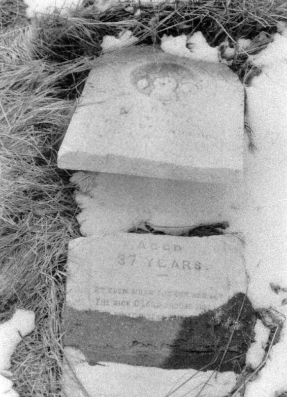 Broken headstone at the cemetery in Exploits, Newfoundland