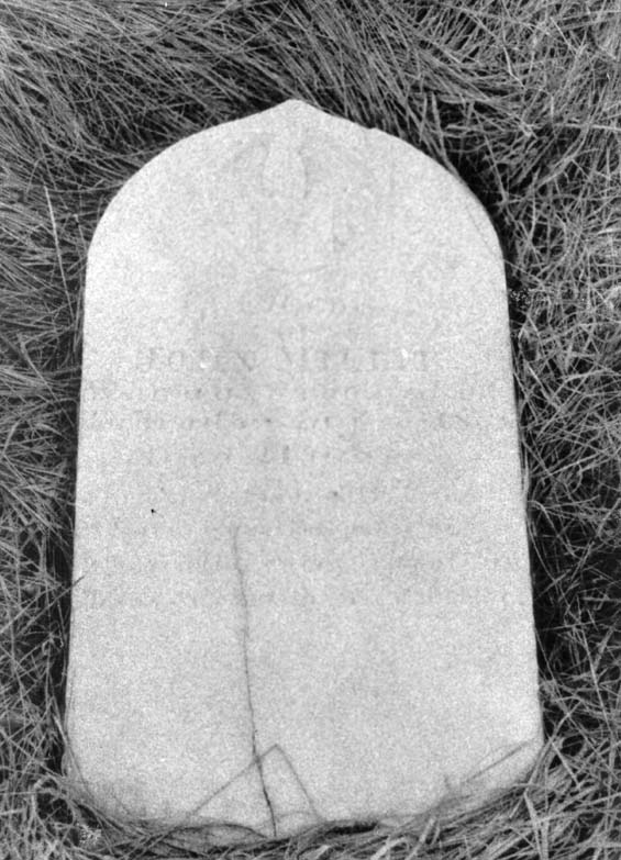 Faded headstone of John Millie, at the cemetery in Exploits, Newfoundland