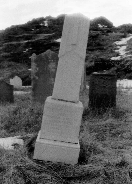 Tilted headstone at the cemetery in Exploits, Newfoundland