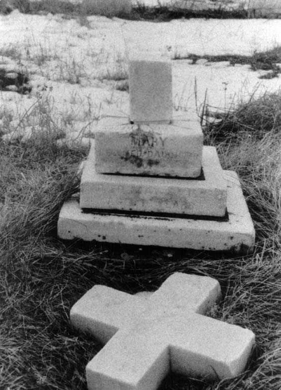 Broken headstone of a young woman named Mary at the cemetery in Exploits, Newfoundland