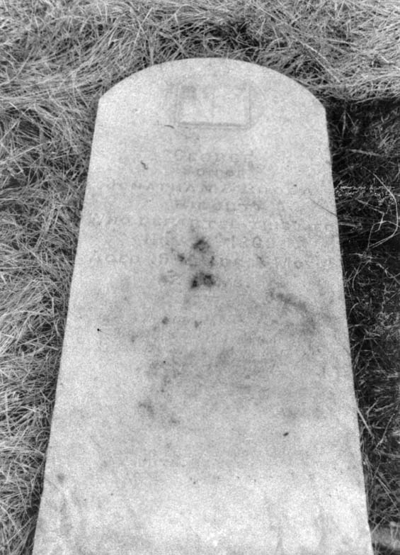 Faded headstone of George Ridout at the cemetery in Exploits, Newfoundland