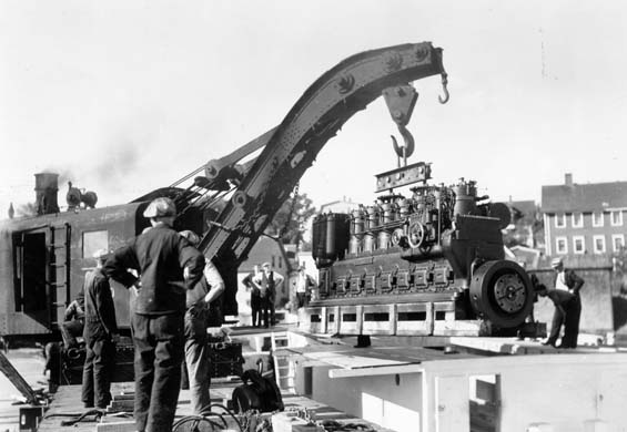 Crane lifting a vessel motor at Lunenburg, Nova Scotia