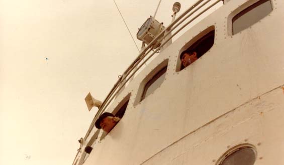 Capt. Morrissey Johnson (left) and Newfoundland Minister of Fisheries, Jim Morgan, looking out of the wheelhouse of the 
