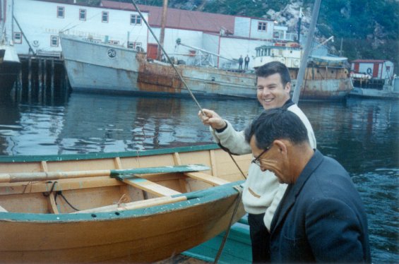 A fishing vessel docked Gaultois Fisheries Ltd. fish plant at Gaultois, south coast of Newfoundland