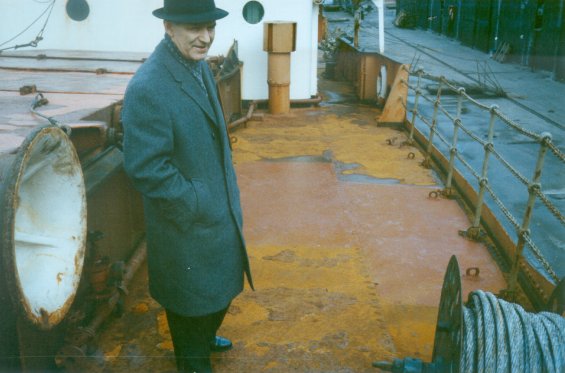 Unidentified man standing on the deck of the 