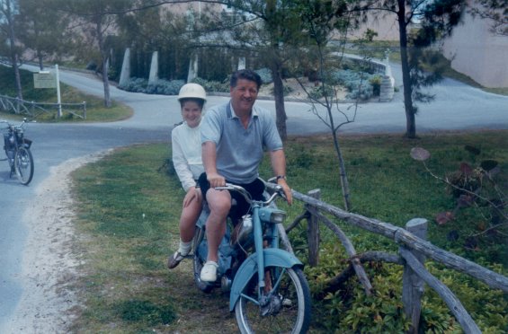 Harold L. Lake and his daughter on a bike during a vacation in St. George, Bermuda