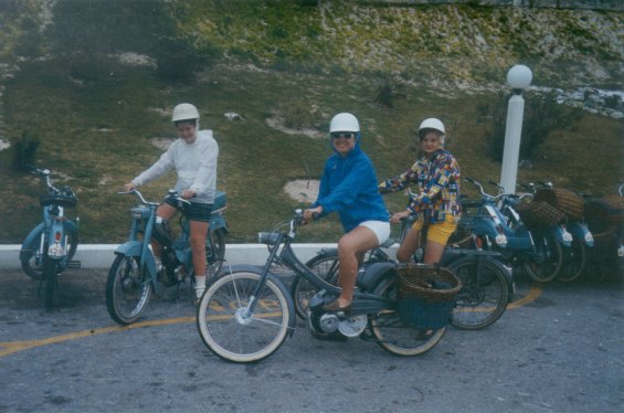 Harold L. Lake's daughters (left and centre) with another girl on bikes during a vacation in St. George, Bermuda