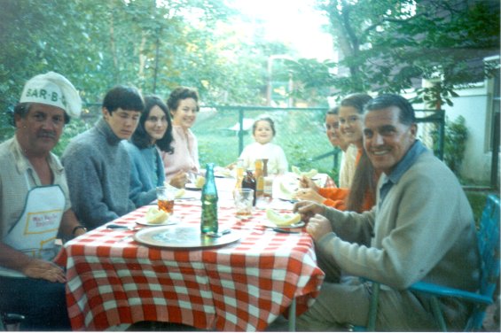 Members of the Lake family having a barbeque