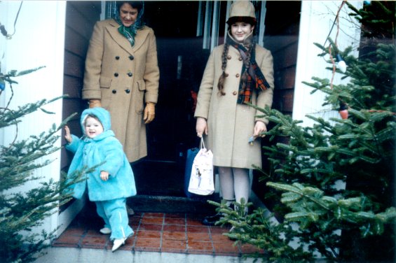 Harold L. Lake's wife, Robin, and two of their daughters in front of their home known as 