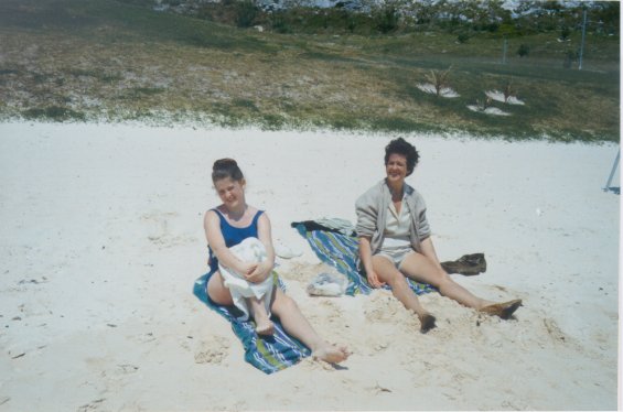 Harold L. Lake's wife, Robin, with her daughter on a sandy beach in St. George, Bermuda during a vacation