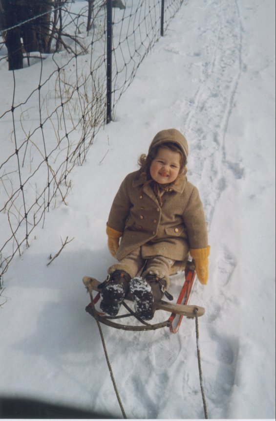 Harold L. Lake's daughter on a sled