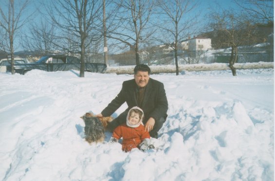 Harold L. Lake with his daughter playing in the snow