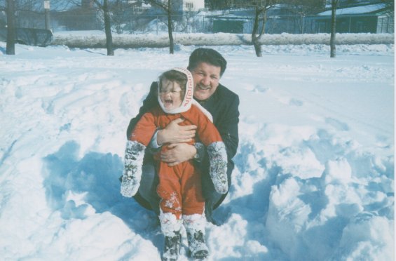 Harold L. Lake with his daughter playing in the snow