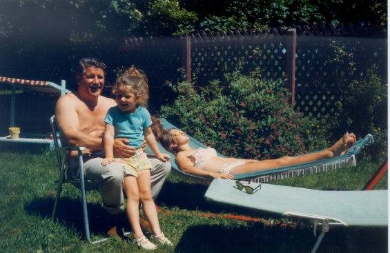Harold L. Lake with his daughters outside in the sun