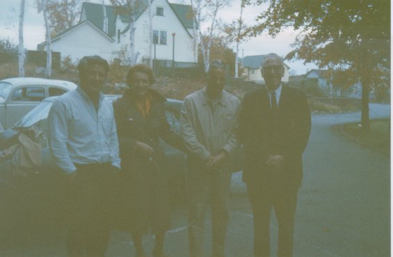 Harold L. Lake (left) with three unidentified people