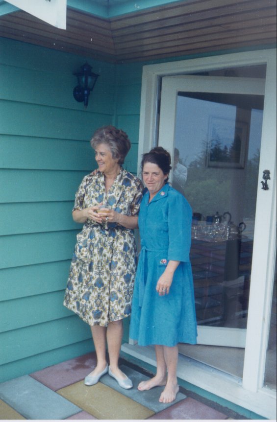 Harold L. Lake's wife, Robin (left), standing on a patio